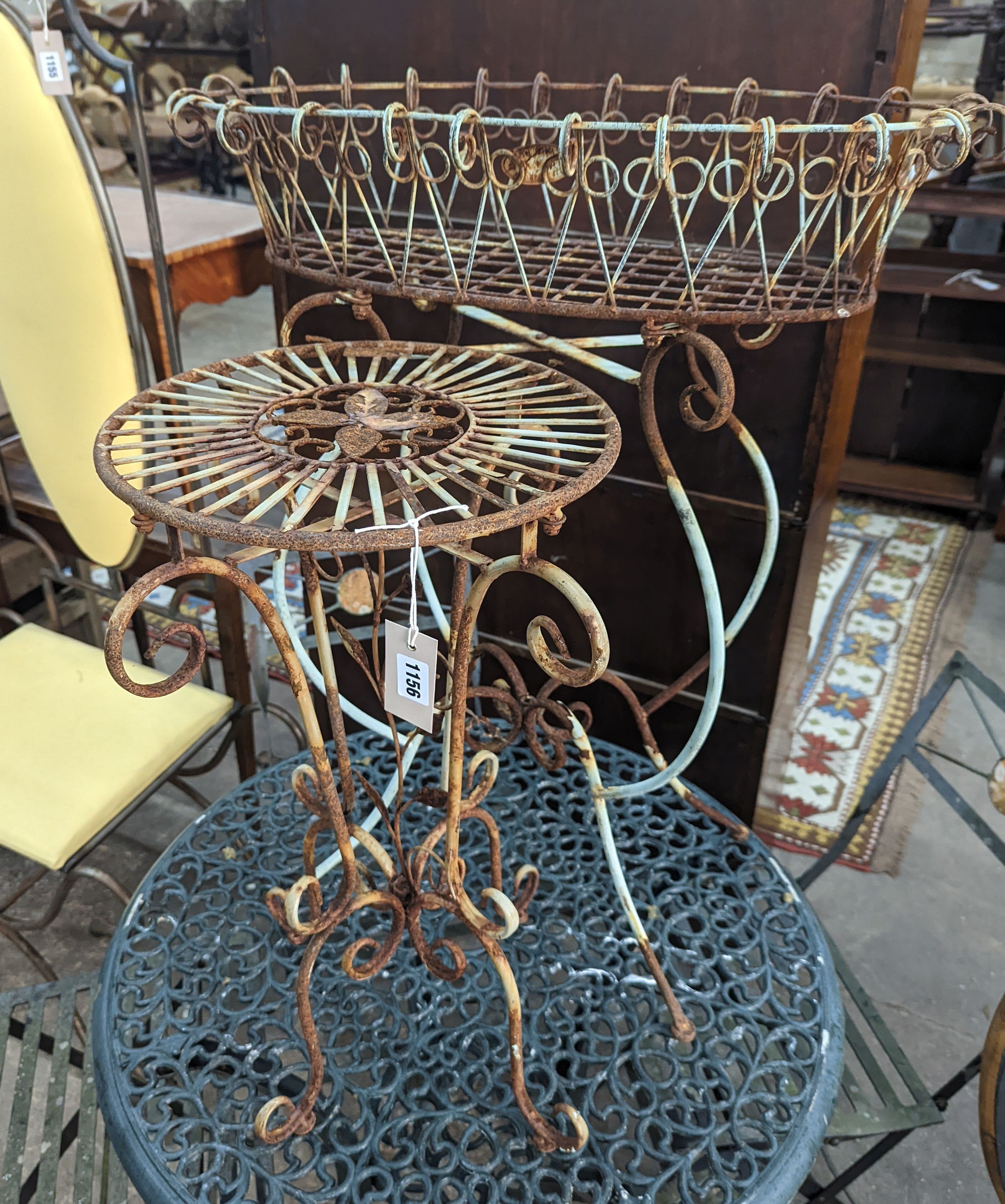 A painted wirework and wrought iron pot stand, height 79cm together with a similar circular table